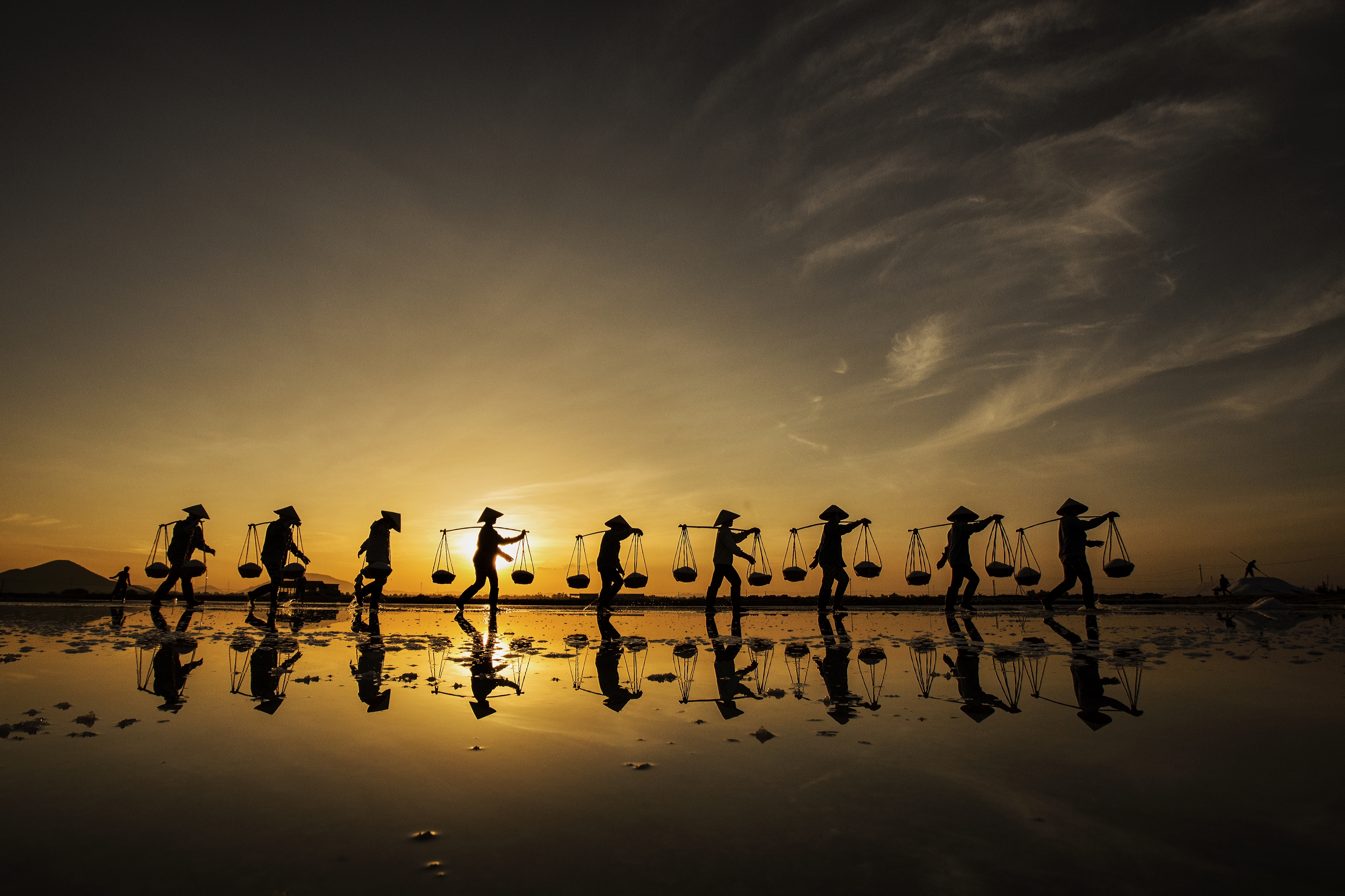 Salt workers are seen working in this photo Nese Ari took in Vietnam