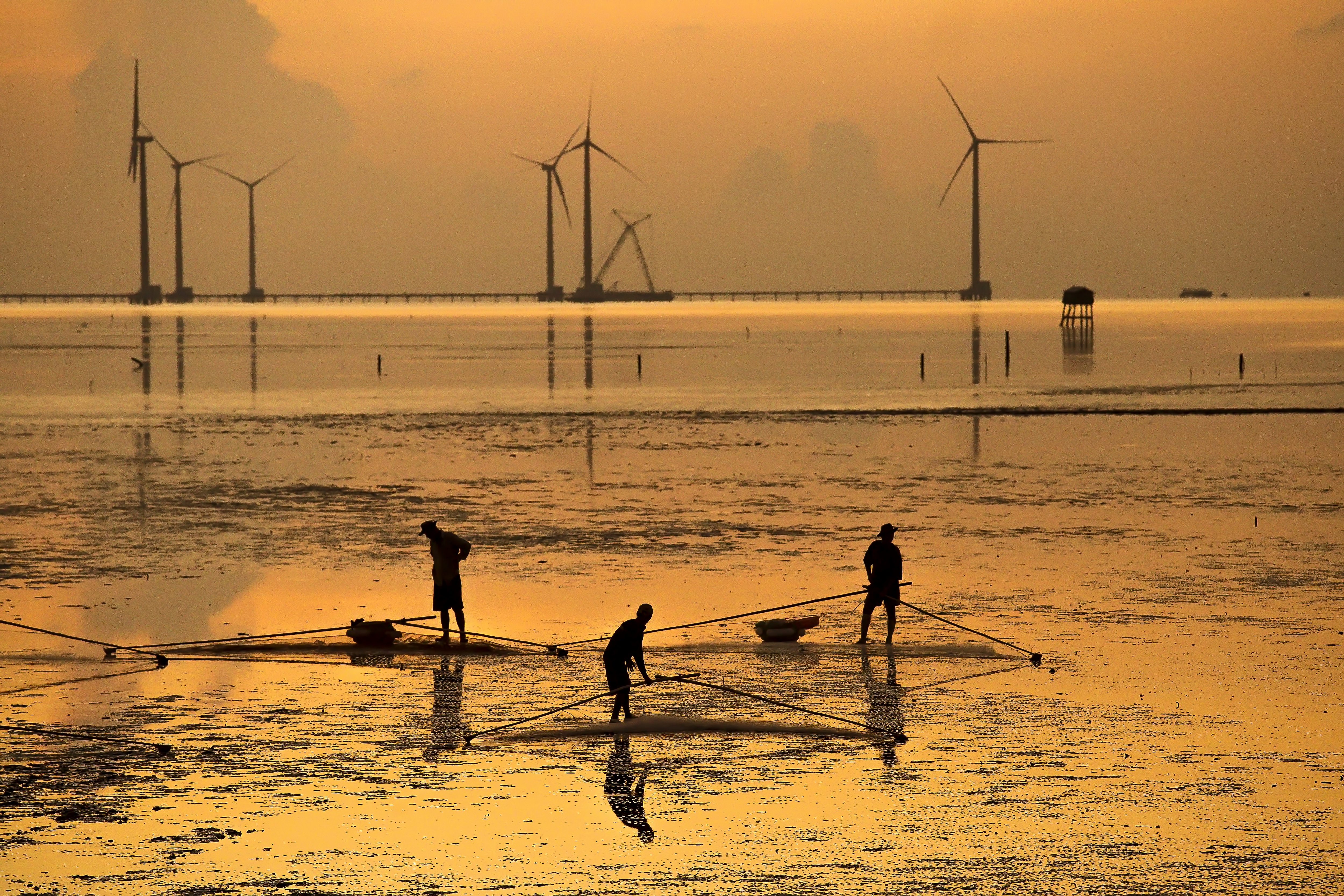 Salt workers are seen working in this photo Nese Ari took in Vietnam
