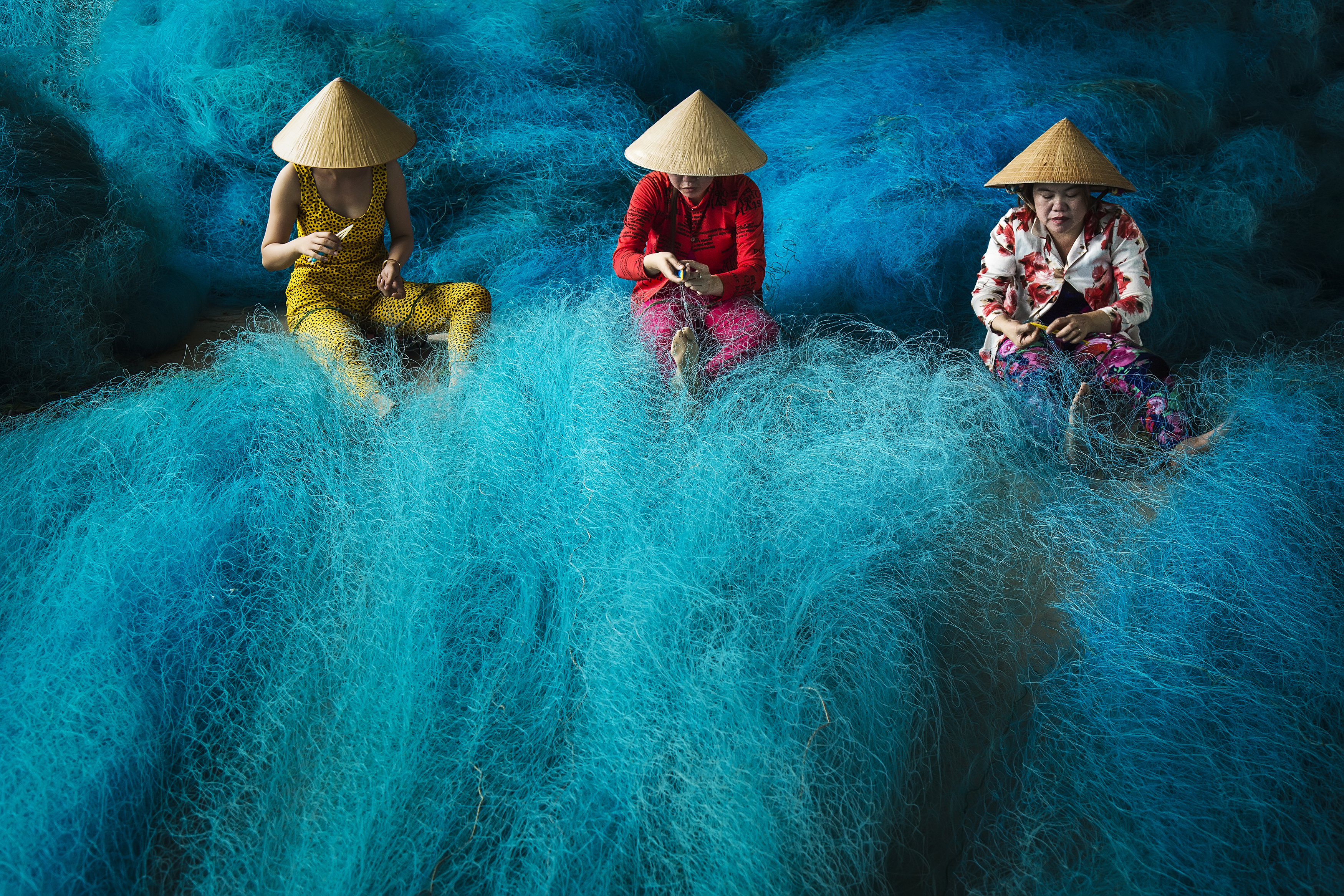 This photo capturing Vietnamese women making fishing net was published on NatGeo's Daily Dozen on August 10, 2017