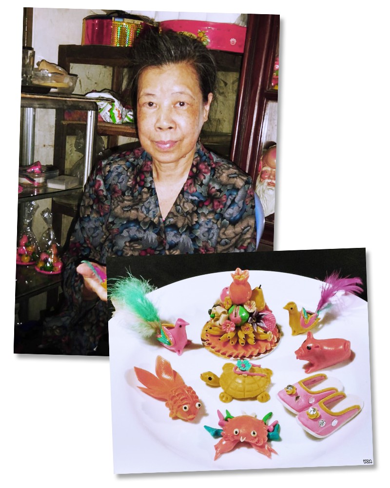 Pham Nguyet Anh with some of her typical Dong Xuan powder figurines. Photo: Trinh Bach