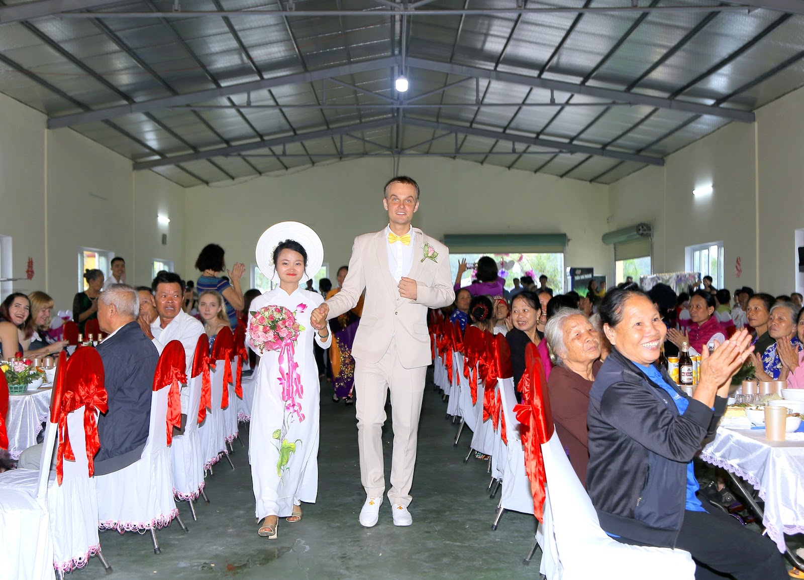 Nguyen Thi Sam and Meigo Mark at their wedding in a photo provided by the couple