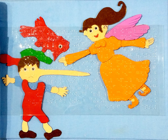    A page of the Pinocchio tactile book. Photo: Lam Dien / Tuoi Tre
