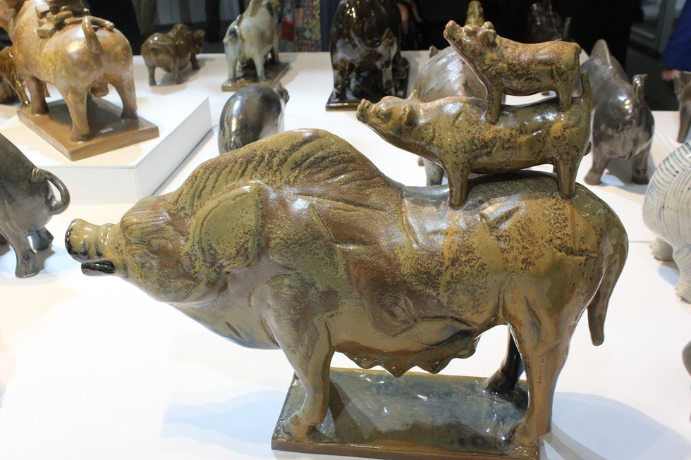 This bizarre piggy trio must have come a long way to make it to the exhibition. Photo: Thien Dieu / Tuoi Tre
