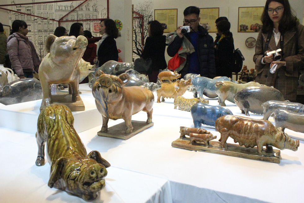 Many visitors are mildly enthralled by the sheer volume of the pig figurines. Photo: Thien Dieu / Tuoi Tre