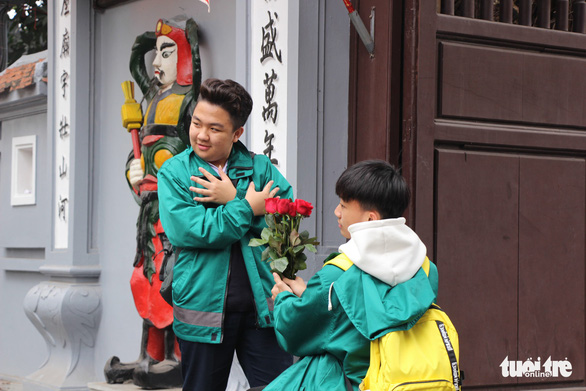 Two boys pose for a funny photo outside the Ha Pagoda in Hanoi. Photo: Ha Thanh / Tuoi Tre
