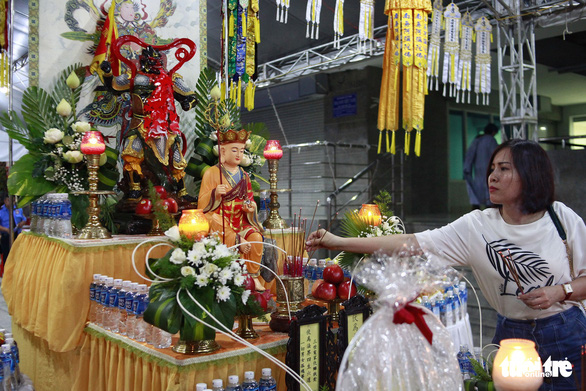 A resident participates in a prayer service at the Carina Plaza apartment complex in District 8, Ho Chi Minh City, March 11, 2019. Photo: Hoang Dong / Tuoi Tre