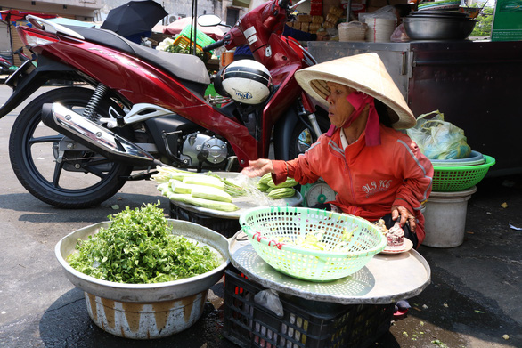 Nguyen Thi Lang, 57, said she has been selling vegetables for 20 years.