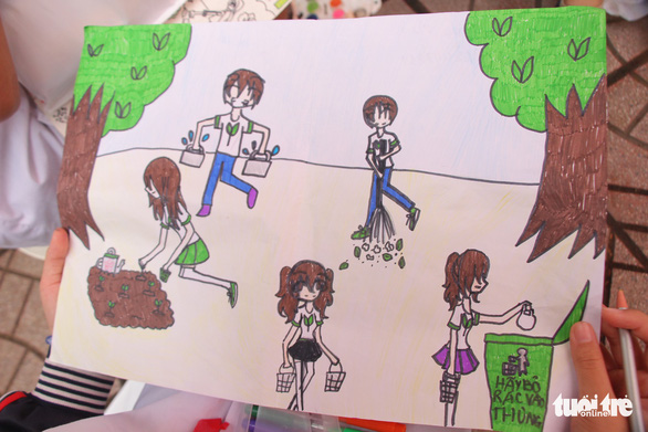 A drawing of people picking up trash and putting it into a bin. Photo: Ha Thanh/Tuoi Tre