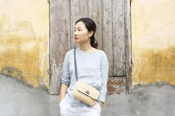 Hai Minh with a raffia and cotton Leinné bag. Photo: Supplied