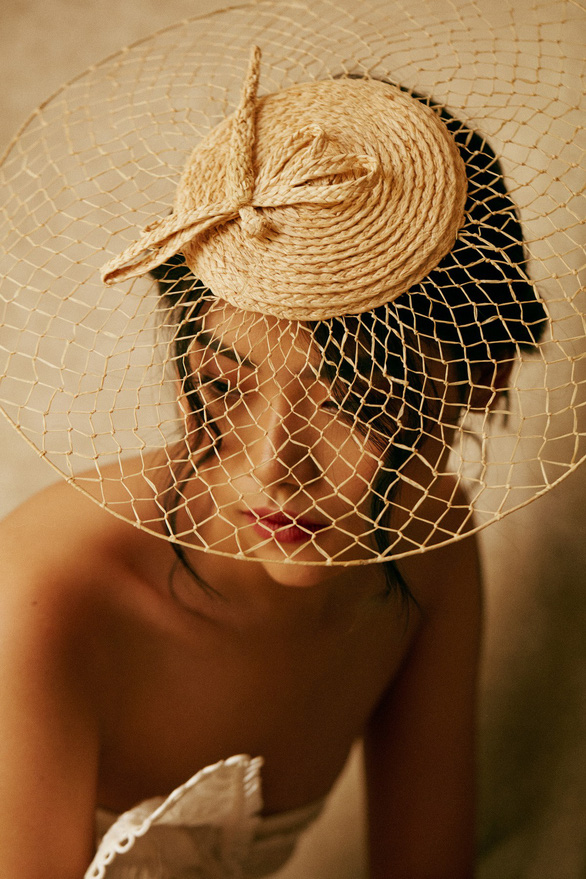 A model poses in Leinné hat made of raffia. Photo: Supplied