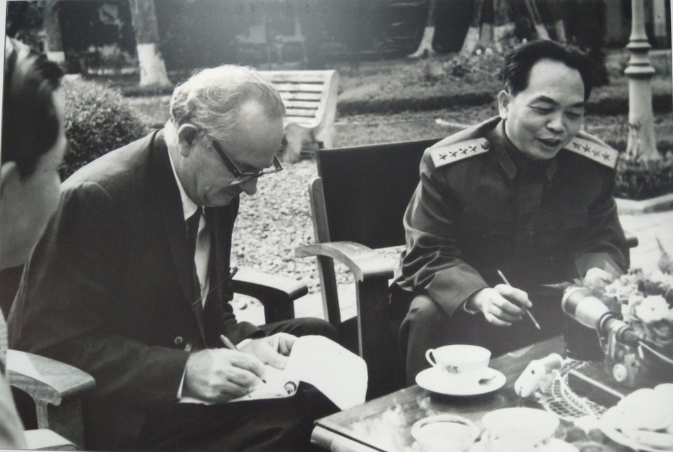 Wilfred Burchett (L) and Vietnamese General Vo Nguyen Giap sit for an interview in Hanoi in 1964.