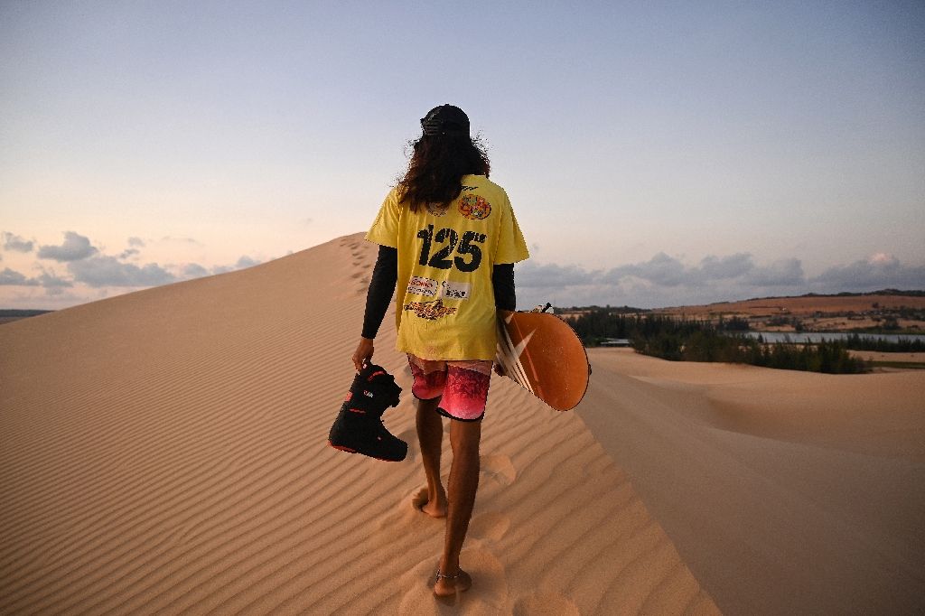 The Asian Winter Games in Sapporo was the first time Vietnam's snowboarders and skiers competed on snow having only ever trained on sand using tree branches as slalom poles on the sandy slopes of Mui Ne. Photo: AFP