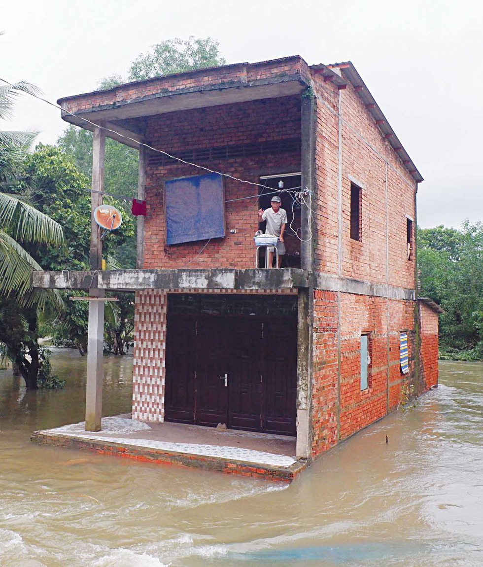 A house is isolated by floodwater.