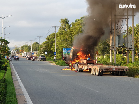 A semi-truck is seen on fire on Phu Quoc Island, off southern Vietnam, September 6, 2019. Photo: Duy Khanh / Tuoi Tre