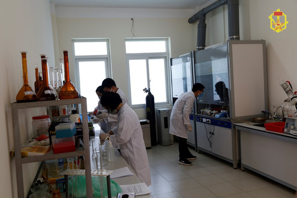 Scientists test for chemical content of samples collected from the remains of the Rang Dong Company warehouses in Hanoi. Photo: People’s Army of Vietnam