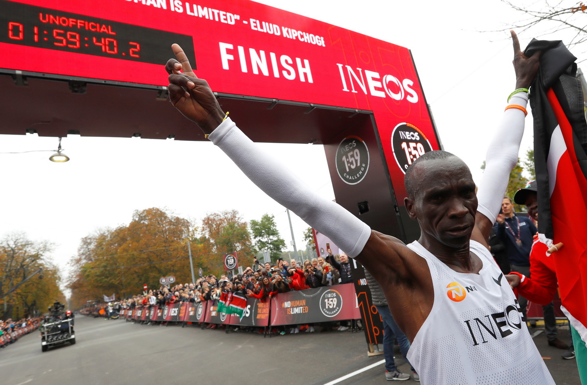 Kenya's Eliud Kipchoge, the marathon world record holder, celebrates after crossing the finish line during his attempt to run a marathon in under two hours in Vienna, Austria, October 12, 2019. Photo: Reuters