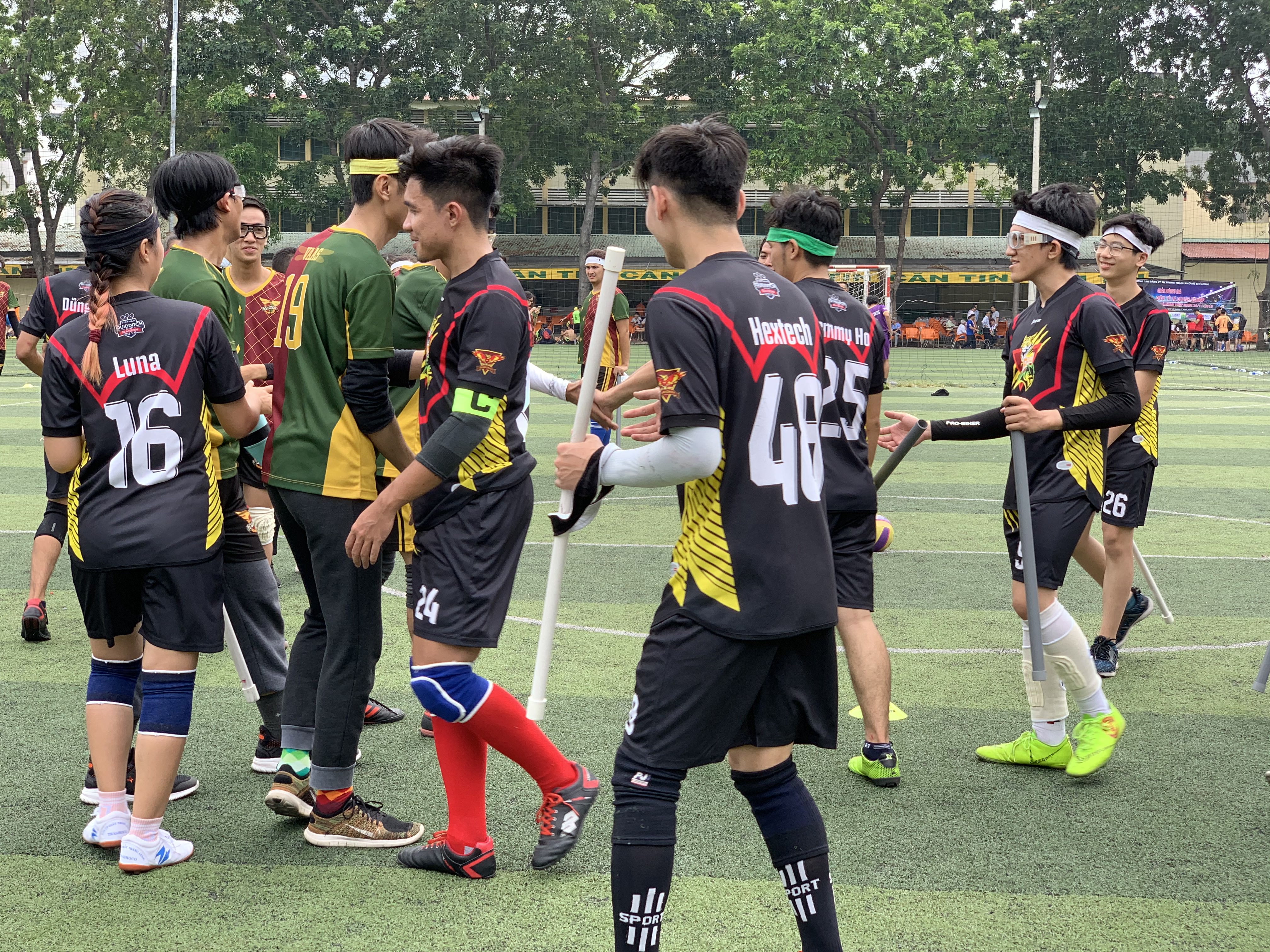 Players shake hand after a match in the maiden Vietnam Quidditch Cup organized by the Vietnam Quidditch Association  in Tan Binh District, Ho Chi Minh City, November 10, 2019. Photo: Bao Anh / Tuoi Tre News