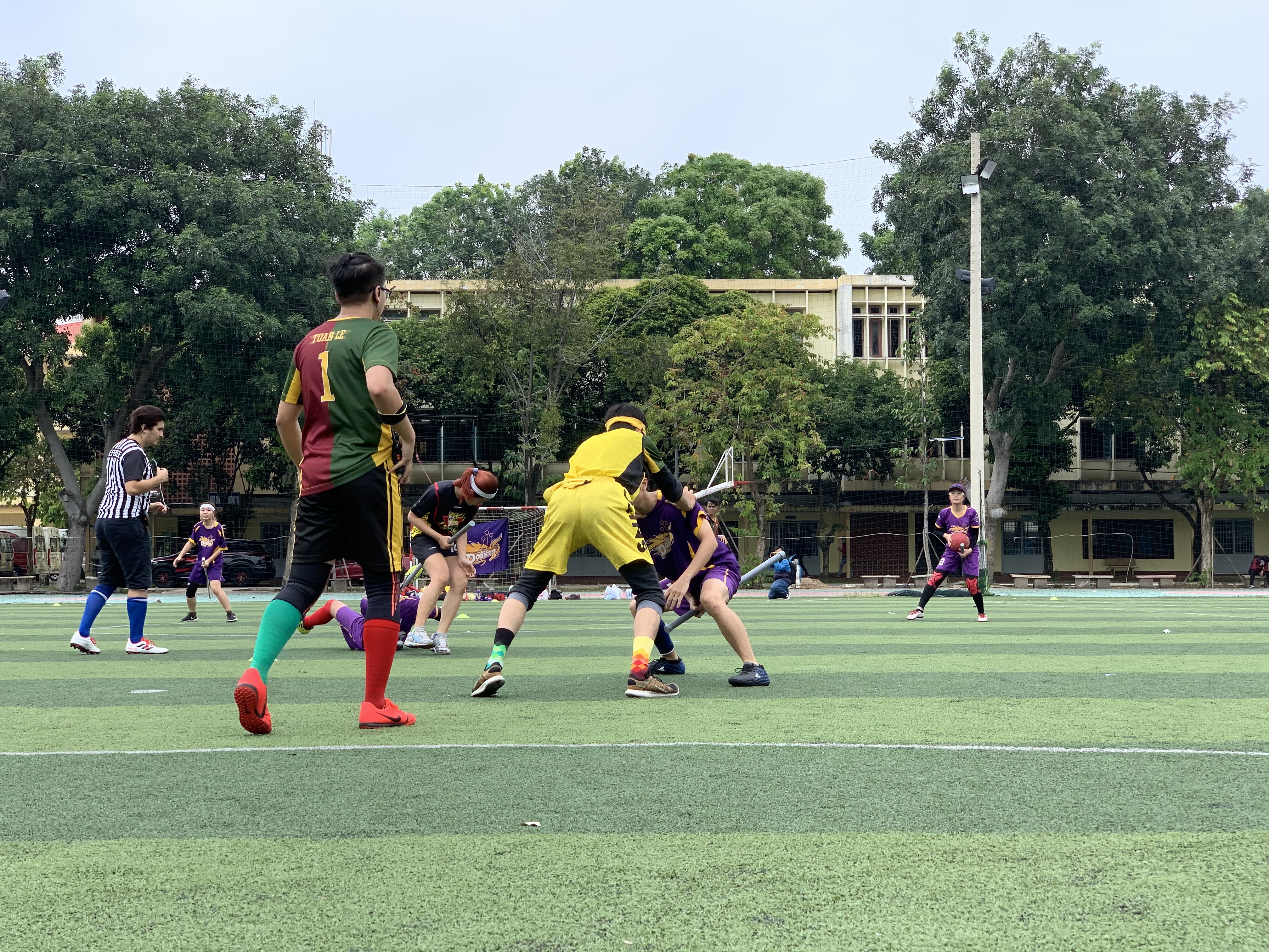 Players fight for a 'snitch' during a match in the maiden Vietnam Quidditch Cup organized by the Vietnam Quidditch Association  in Tan Binh District, Ho Chi Minh City, November 10, 2019. Photo: Bao Anh / Tuoi Tre News