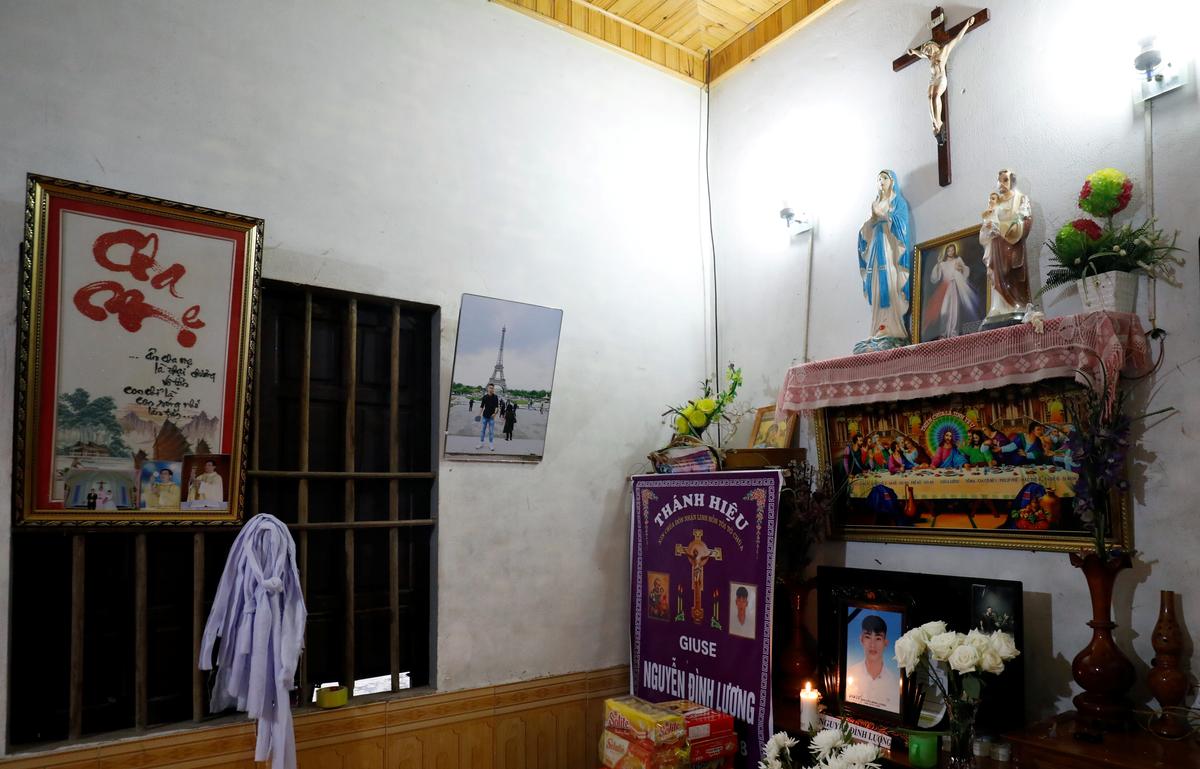 Images of Nguyen Dinh Luong, a victim who was found dead in the back of British truck, are seen at his home after his funeral in Ha Tinh Province, Vietnam November 29, 2019. Photo: Reuters