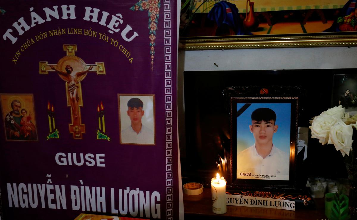 Images of Nguyen Dinh Luong, a victim who was found dead in the back of British truck, are seen at his home after his funeral in Ha Tinh Province, Vietnam November 29, 2019. Photo: Reuters