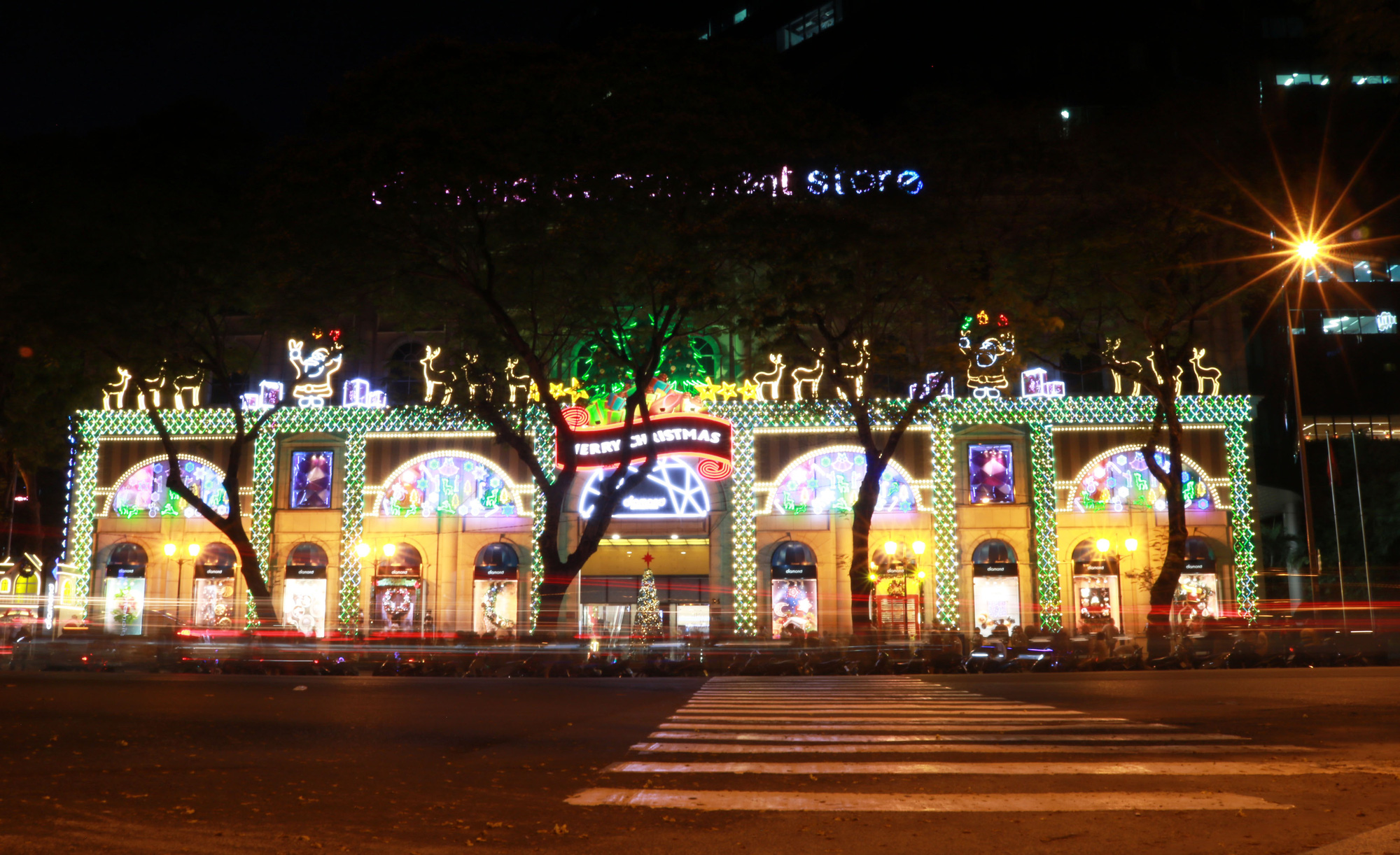 Diamond Plaza in downtown Ho Chi Minh City lights up in the evening. Photo: Nhat Thinh / Tuoi Tre