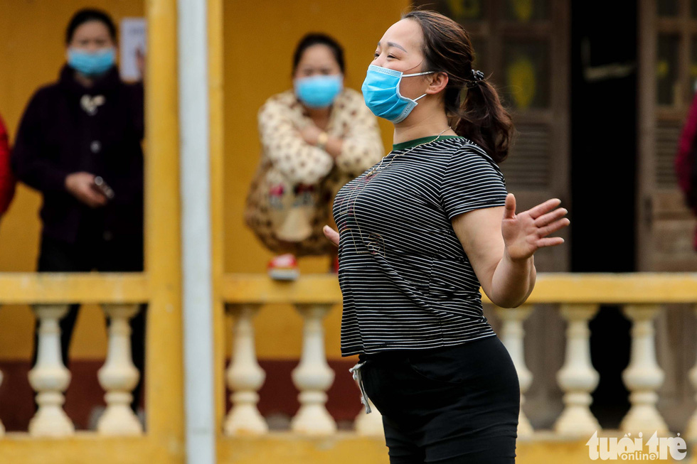 A woman in quarantine for the novel coronavirus dances to music at the Military School of Lao Cai Province in northern Vietnam. Photo: Nguyen Khanh / Tuoi Tre