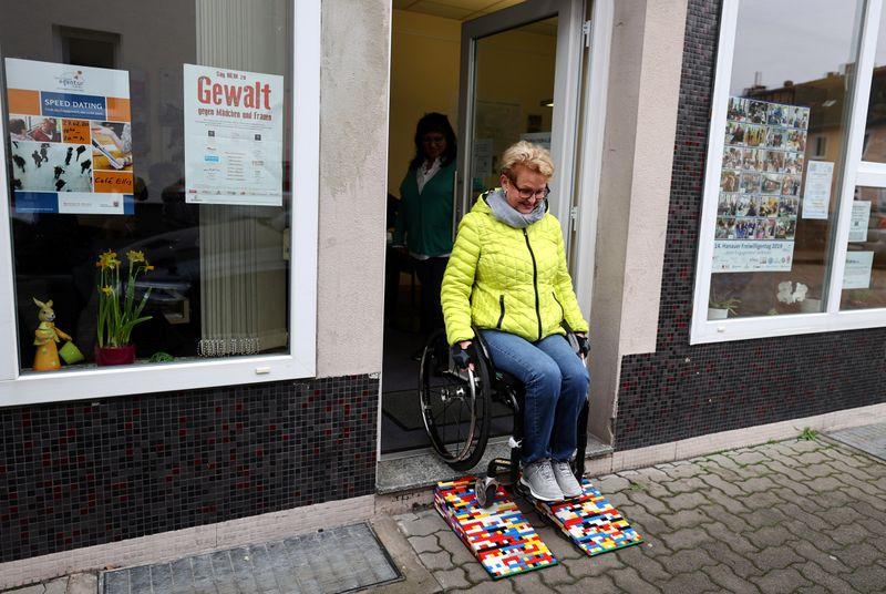 Rita Ebel, nicknamed 'Lego grandma,' tests one of her wheelchair ramps built from donated Lego bricks in Hanau, Germany, February 17, 2020. Picture taken February 17, 2020. Ebel started to build the ramps almost one year ago to raise awareness for handicapped people in her hometown of Hanau. Meanwhile, dozens of stores use the ramps to ease entry for wheelchair users.  Photo: Reuters
