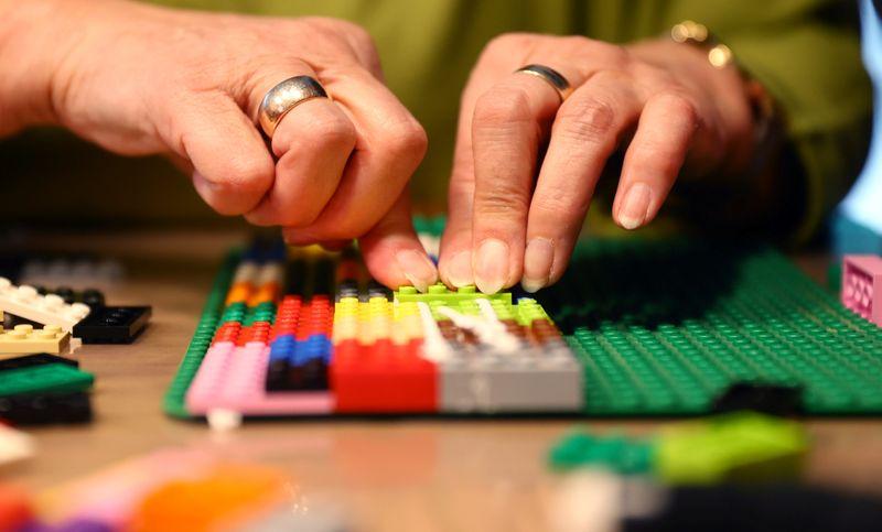 Rita Ebel, nicknamed 'Lego grandma,' builds a wheelchair ramp from donated Lego bricks in the living room of her flat in Hanau, Germany, February 17, 2020. Picture taken February 17, 2020. Ebel started to build the ramps almost one year ago to raise awareness for handicapped people in her hometown of Hanau. Meanwhile, dozens of stores use the ramps to ease entry for wheelchair users.  Photo: Reuters