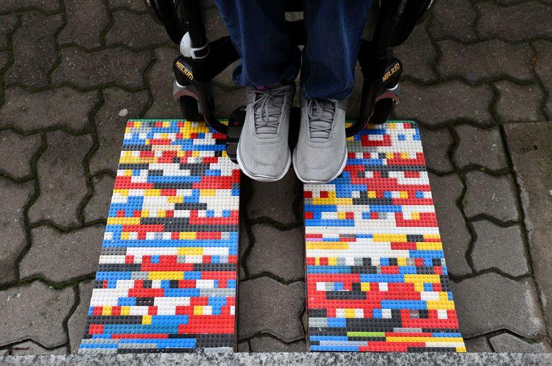 Rita Ebel, nicknamed 'Lego grandma,' tests one of her wheelchair ramps built from donated Lego bricks in Hanau, Germany, February 17, 2020. Picture taken February 17, 2020. Ebel started to build the ramps almost one year ago to raise awareness for handicapped people in her hometown of Hanau. Meanwhile, dozens of stores use the ramps to ease entry for wheelchair users.  Photo: Reuters