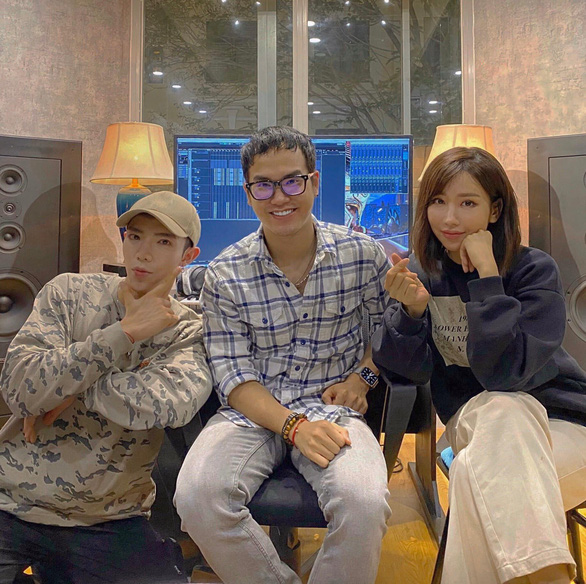 Khac Hung (C) with singers Min (R) and Erik are seen in a photo posted on Erik's verified Facebook account