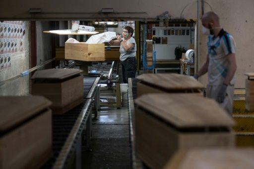 The factory has stepped up production even though 15 percent of its staff are at home due to confinement measures. Photo: AFP