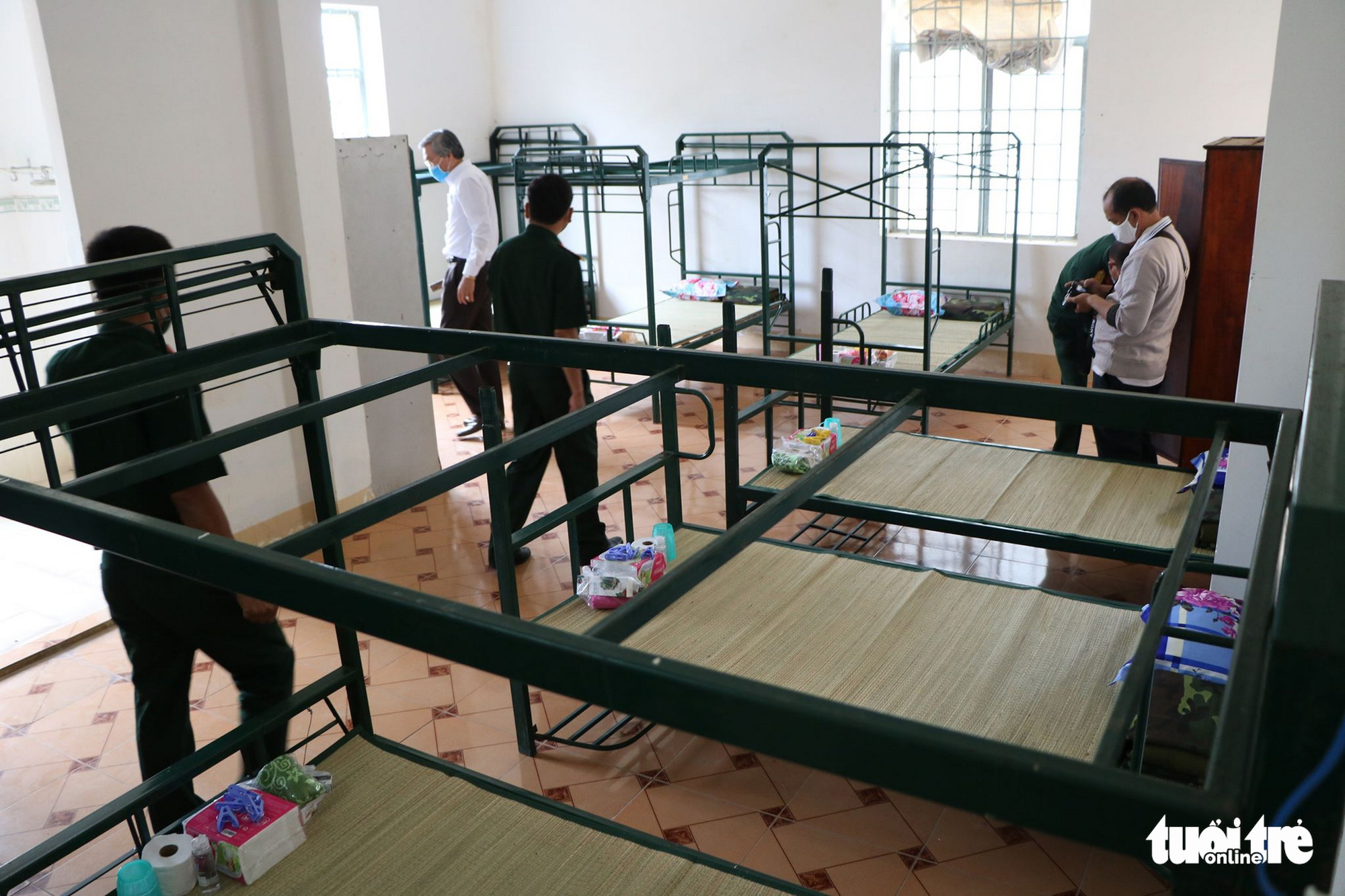 Officers inspect a room inside a facility for novel coronavirus disease (COVID-19) quarantine in Ninh Thuan Province, Vietnam. Photo: Minh Tran / Tuoi Tre