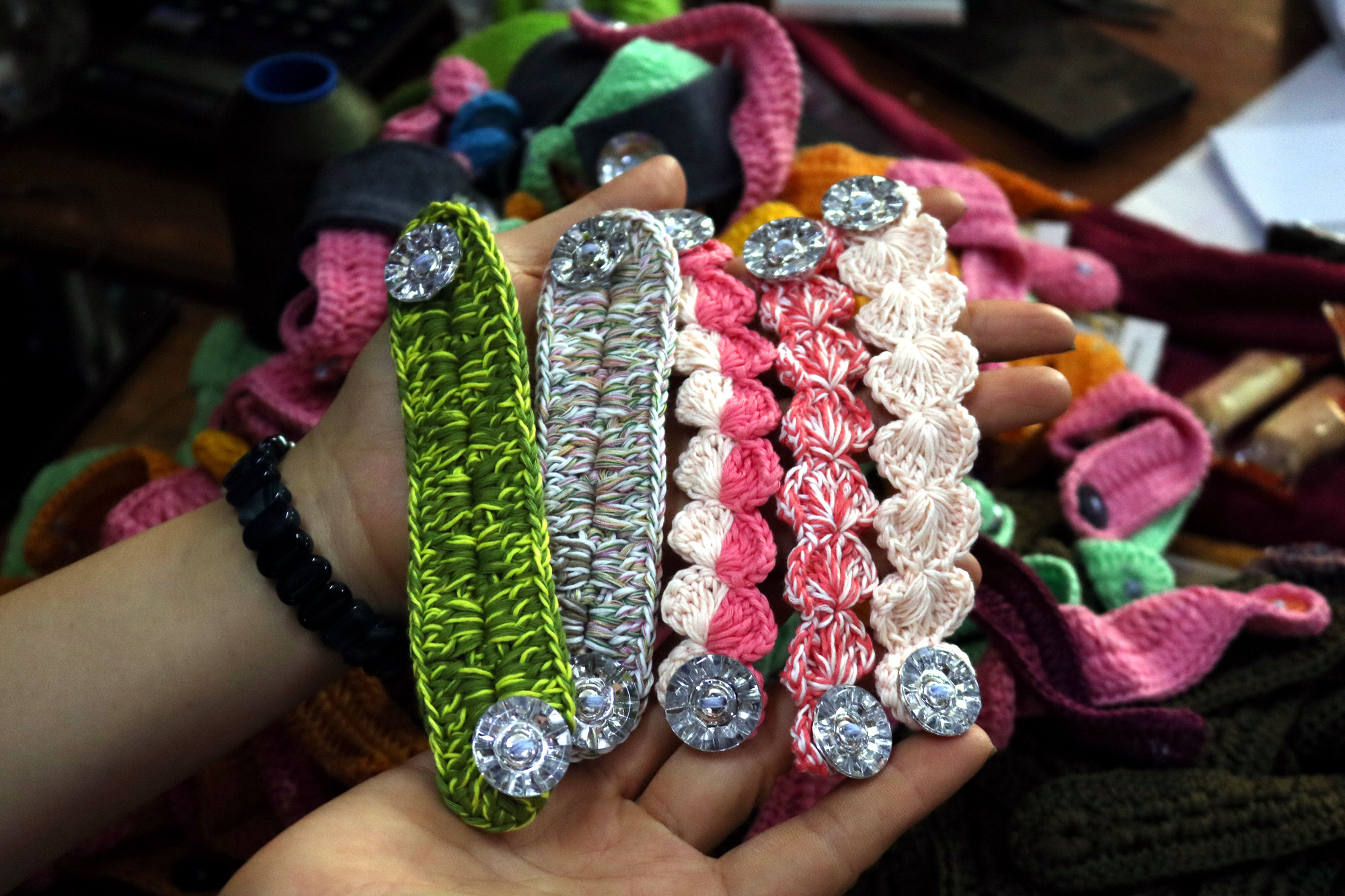 Some colorful finished ear savers made by a 67-year-old member of Phan Thi Thuong’s knitting group in Tan Phu District, Ho Chi Minh City. Photo: Hoang An / Tuoi Tre
