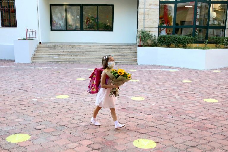 Even as the numbers of infections rise, pupils are returning to school. Photo: AFP