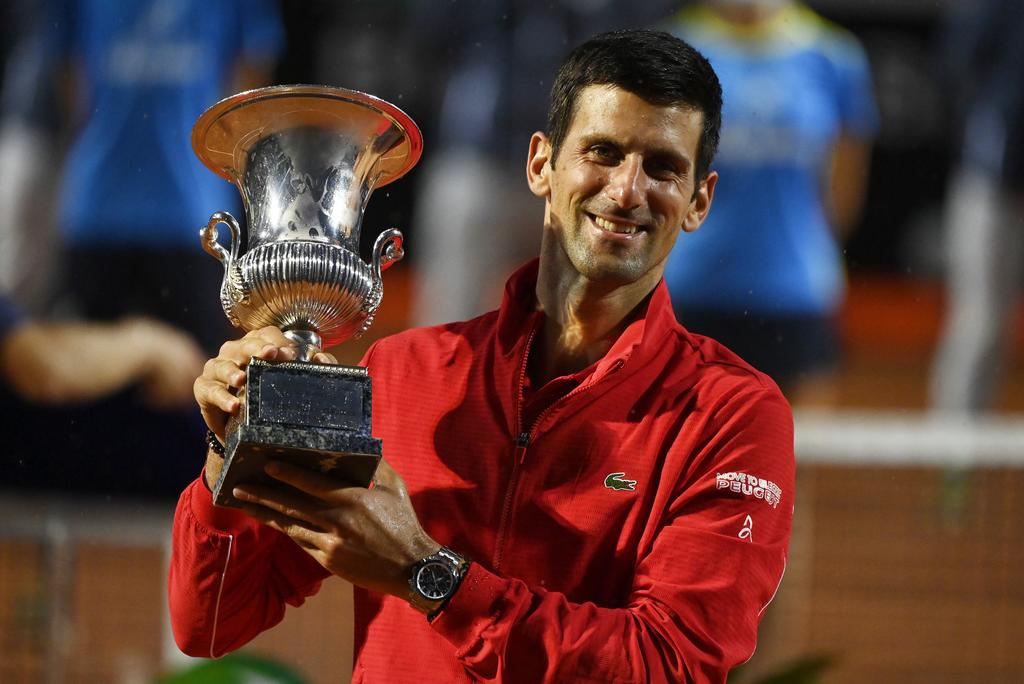 Serbia's Novak Djokovic celebrates with the trophy after winning the final against Argentina's Diego Schwartzman - ATP Masters 1000 - Italian Open - Foro Italico, Rome, Italy - September 21, 2020. Photo: Reuters