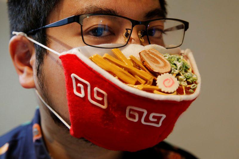 Japanese designer Takahiro Shibata's wears a protective mask that looks like a steaming bowl of ramen noodle soup while posing for a photo at his house, following the coronavirus disease (COVID-19) outbreak in Yokohama, Japan September 23, 2020. Photo: Reuters