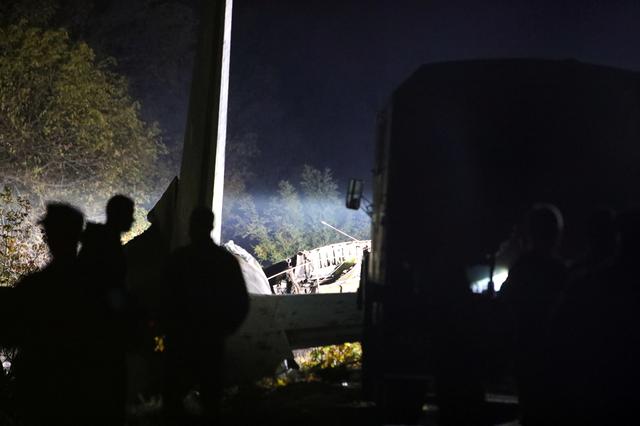Rescuers inspect wreckages of the Ukrainian military Antonov An-26 plane after crashing outside of Chuhuiv town, Ukraine, September 25, 2020. Photo: Reuters