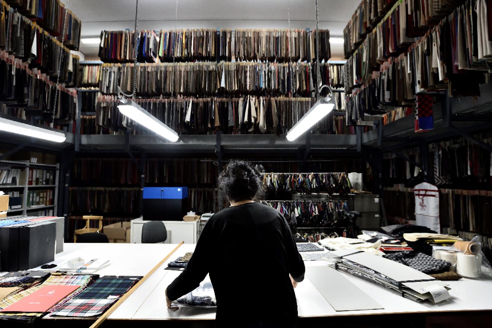 An employee works at Fratelli Piacenza wool mill in Pollone, near Biella, northern Italy, October 8, 2020. Photo: Reuters