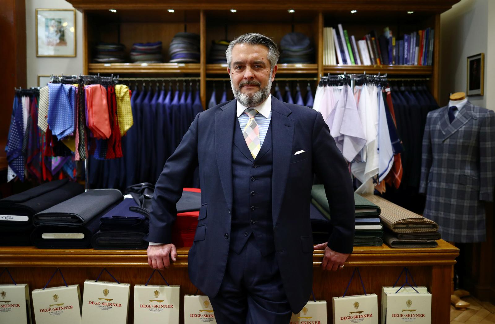 Dege & Skinner Managing Director William Skinner poses for a portrait in the Dege & Skinner tailors on Savile Row, amid the coronavirus disease (COVID-19) outbreak, in London, Britain October 7, 2020. William Skinner is a fifth-generation tailor and the third to run the Savile Row shop Dege & Skinner. Established in 1865, Dege & Skinner is one of only two family-owned Savile Row firms. Its clients include businessmen, generals and royals including Prince Harry, who chose the brand for his wedding uniform. Business has been “quite challenging,” but since reopening in June, the shop has seen “quite a lot” of new customers. “It’s been on their bucket list for a long time,” Skinner said about some of his new customers, who think: “if I get COVID, then I might never do this, so let’s do it now’.” “There’s a whole raft of attitudes out there … feedback we’ve had from some of our clients is ‘we’ve had nothing to spend our money on over the last 3-6 months, so I’m going to buy a new suit’.” Nevertheless, orders for the past six months are about one-quarter of what they would normally be. The company usually makes about 500-600 suits a year, starting at £5,500 each. Picture taken October 7, 2020. Photo: Reuters