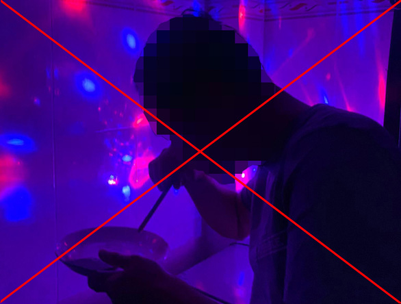 A drug user is seen inhaling ketamine inside a karaoke bar in Ho Chi Minh City. Photo: Tung Nguyen / Tuoi Tre