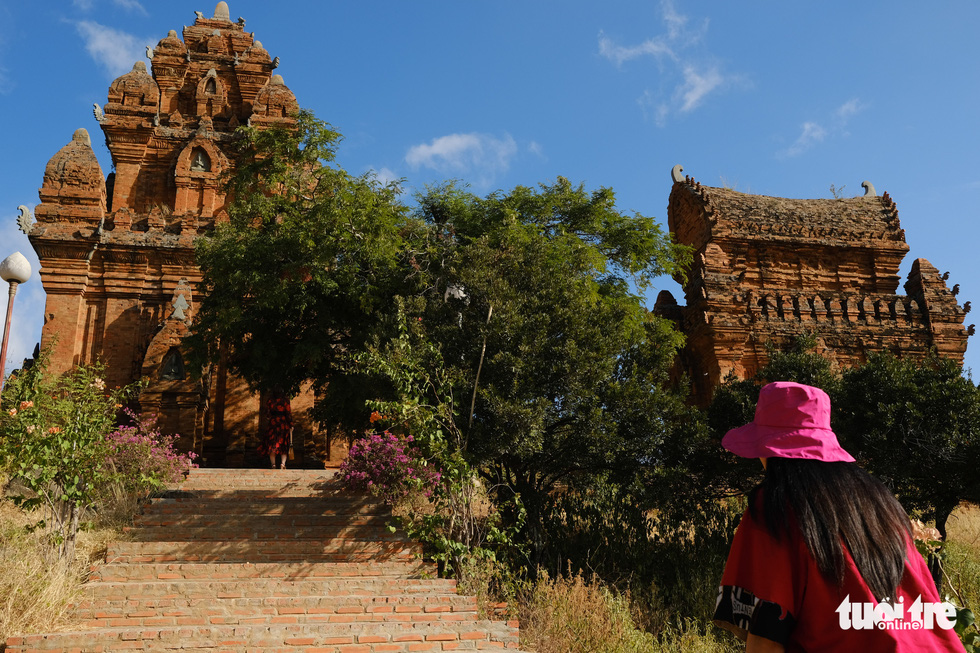A woman climbs on brick steps to the main area of Po Klong Garai Cham temples in Ninh Thuan Province, south-central Vietnam. Photo: Tan Luc / Tuoi Tre