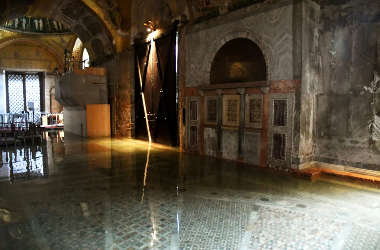 A view shows the flooded entrance of St. Mark's Basilica on December 8, 2020 in Venice following a high tide 'Alta Acqua' event following heavy rains and strong winds, and the mobile gates of the MOSE Experimental Electromechanical Module that protects the city of Venice from floods, were not lifted. Photo: AFP