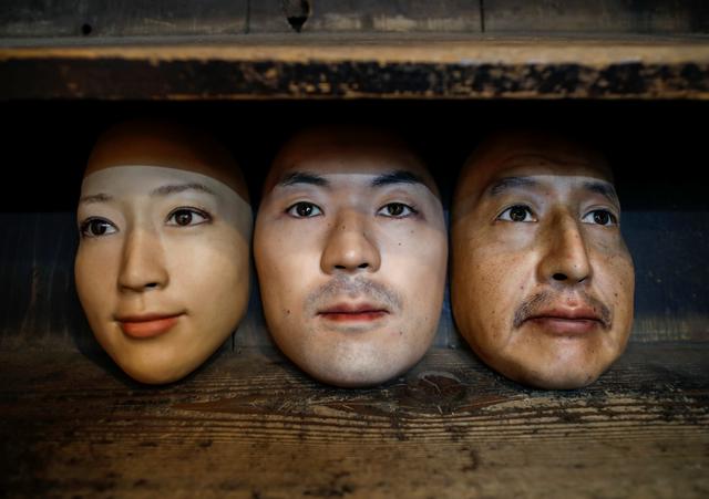 Masks based on real people's faces are diplayed at the Shuhei Okawara's mask shop in Tokyo, Japan December 16, 2020. Photo: Reuters