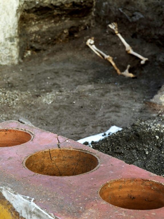 Duck bone fragments as well as remains of pigs, goats, fish and snails were in earthenware pots -- some ingredients cooked together rather as a paella. Photo: AFP