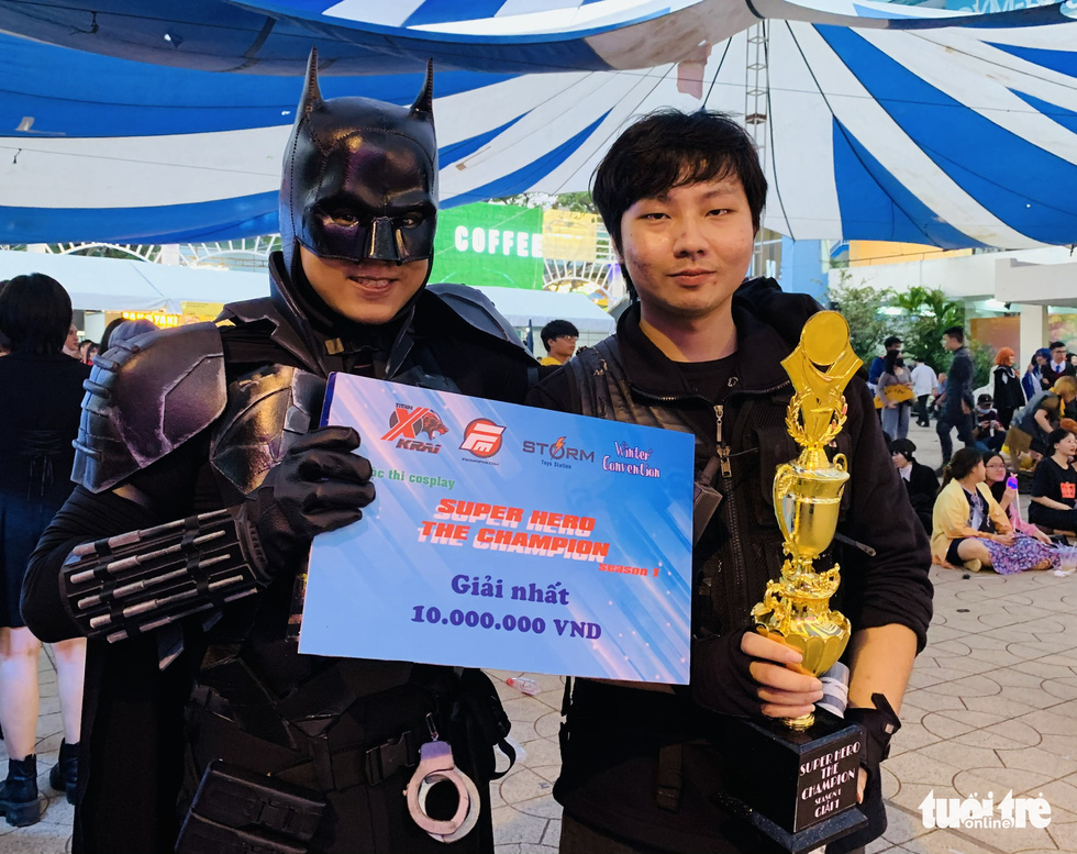 Nguyen The Quan (left) wins the first prize at the cosplay contest Super Hero The Champion Season 1 for his Batman costume in District 5, Ho Chi Minh City, December 27, 2020. Photo: Phuong Nam / Tuoi Tre