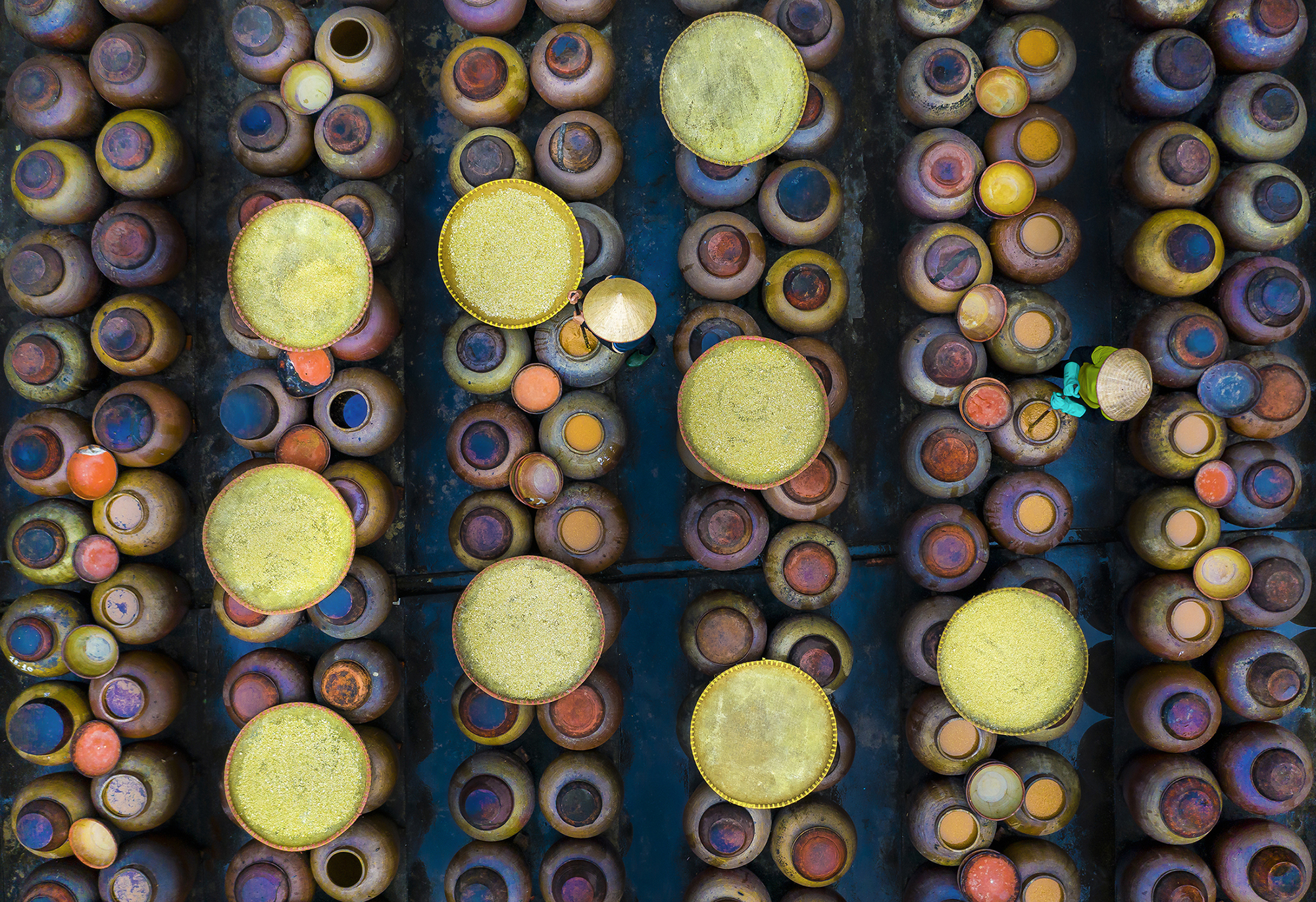 People are seen making soy sauce in this photo