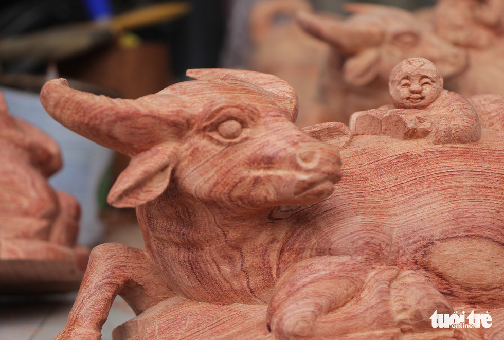 A wooden buffalo in a lying posture is pictured at Dinh Quan Village, Tien Phong Commune of Thuong Tin District, Hanoi. Photo: Ha Quan / Tuoi Tre