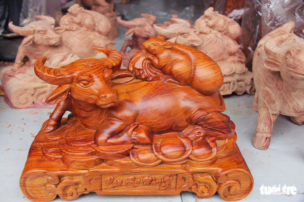 A wooden buffalo in a lying posture is pictured at Dinh Quan Village, Tien Phong Commune of Thuong Tin District, Hanoi. Photo: Ha Quan / Tuoi Tre