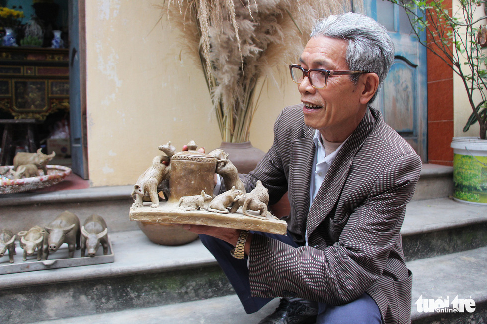 Artisan Phung Dinh Giap holds a clay ornament at Dong Khe Village, Song Khe Commune, Thuan Thanh Ditsrict, Bac Ninh Province, Vietnam. Photo: Ha Quan / Tuoi Tre