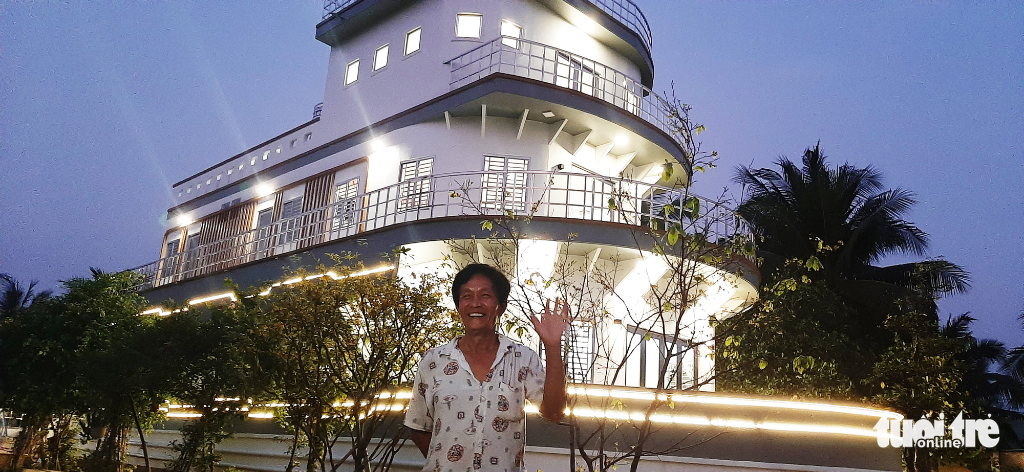 Cao Van Nam in front of his yacht-shaped house in Vinh Long Province, Vietnam, February 2021. Photo: Chi Hanh / Tuoi Tre